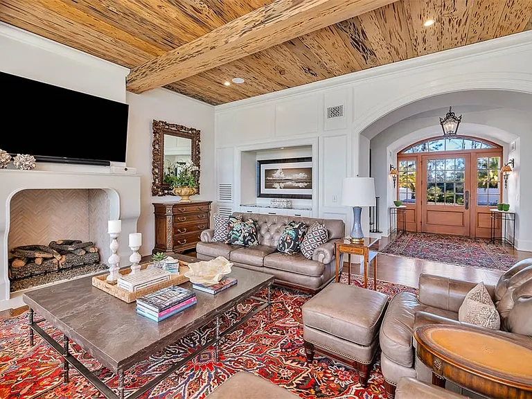 Most beautiful mansion on Saint Simons Island, Georgia, interior living room with high wood beamed ceilings overlooking the jekyll bridge