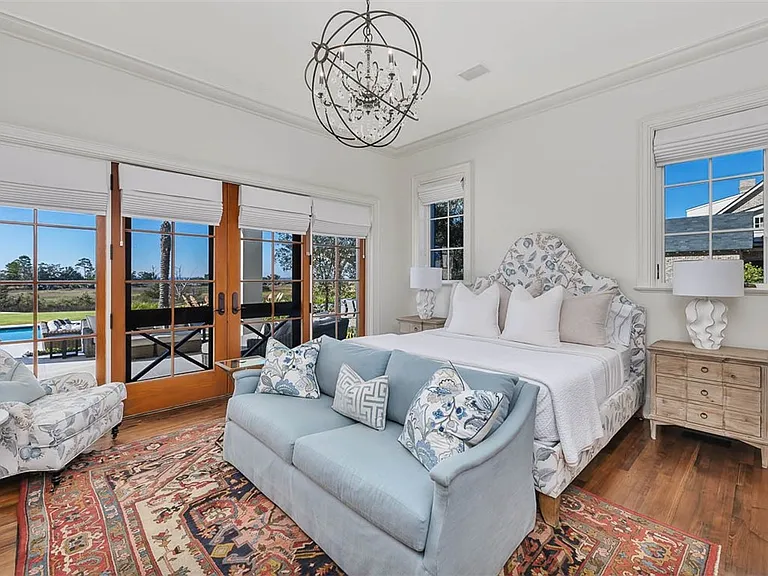 Most beautiful mansion on Saint Simons Island, Georgia, blue and white guest bedroom with modern decor and views of Jekyll Island