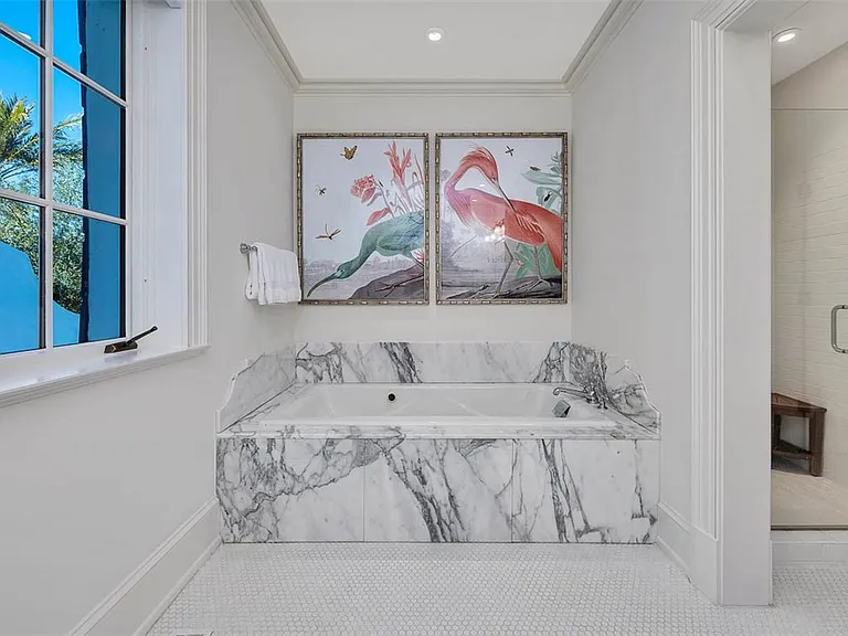 Most beautiful mansion on Saint Simons Island, Georgia, gray and white guest bathroom with modern decor and views of Jekyll Island