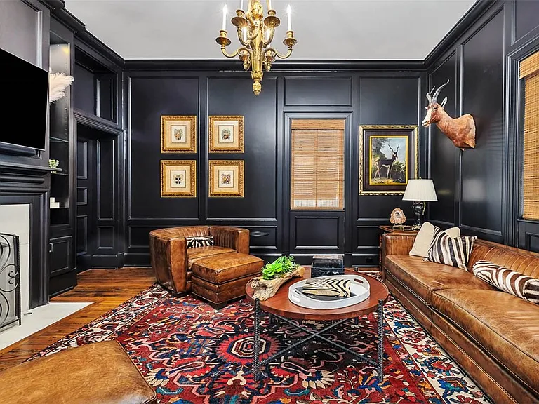 Most beautiful mansion on Saint Simons Island, Georgia, livjng room with natural wood finishes and black walls