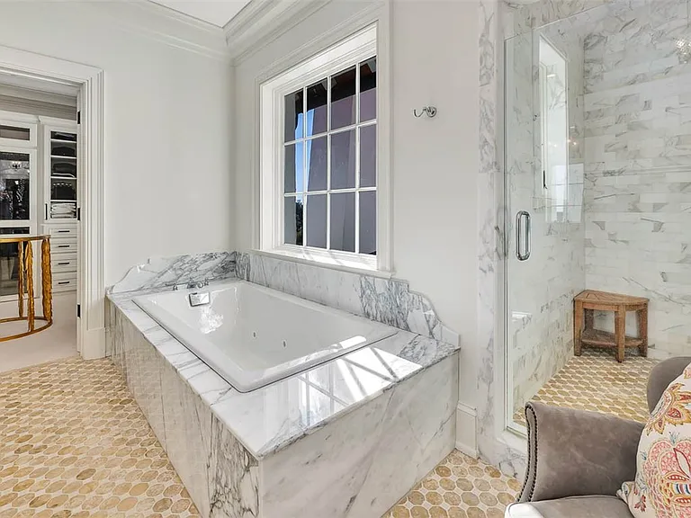 Most beautiful mansion on Saint Simons Island, Georgia, soaking tub in gray and white italian marble