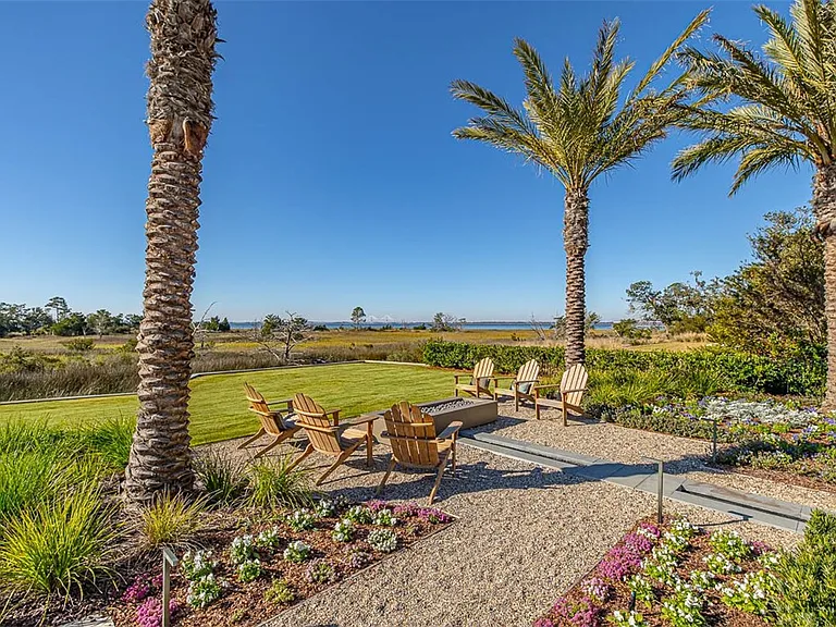 Most beautiful mansion on Saint Simons Island, Georgia, exterior guest house and seating area with fire pit