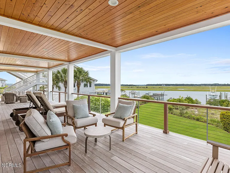 Wilmington Beach Mansion with Panoramic Views, exterior covered porch facing the atlantic marshes of north carolina