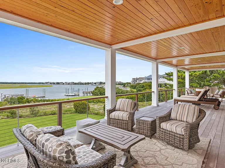 Wilmington Beach Mansion with Panoramic Views, exterior covered porch facing the atlantic marshes of north carolina