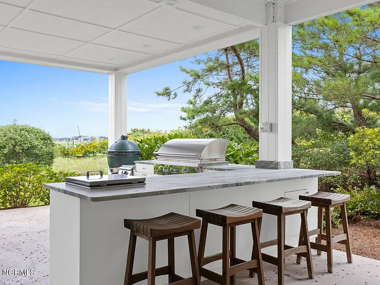 Wilmington Beach Mansion with Panoramic Views, exterior covered outdoor kitchen facing the atlantic marshes of north carolina