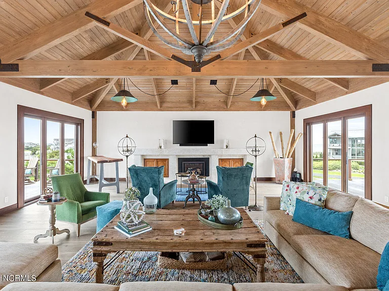 Wilmington Beach Mansion with Panoramic Views, renovated turquoise and natural wood living room with vaulted ceilings and exposed wood