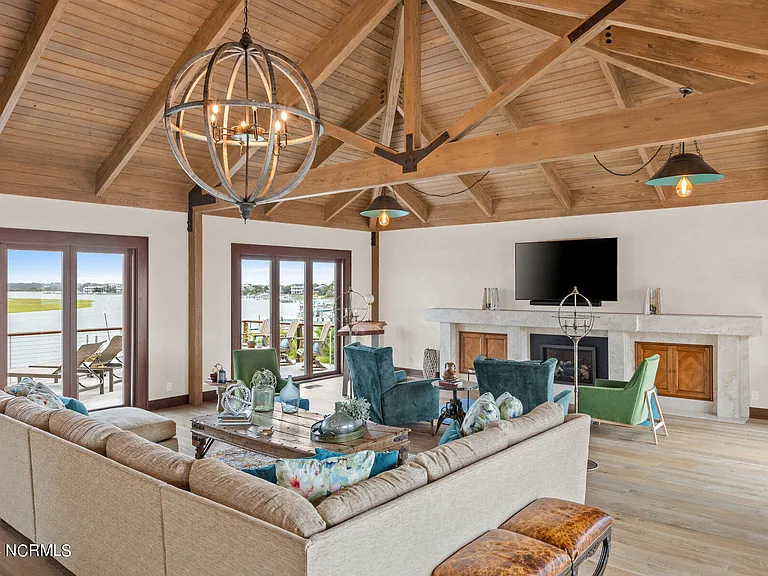 Wilmington Beach Mansion with Panoramic Views, renovated turquoise and natural wood living room with vaulted ceilings and exposed wood