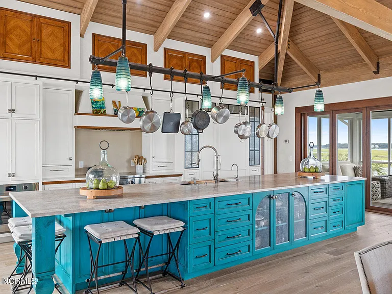 Wilmington Beach Mansion with Panoramic Views, renovated turquoise and natural wood kitchen with vaulted ceilings and exposed wood