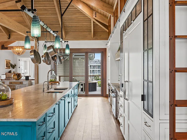 Wilmington Beach Mansion with Panoramic Views, renovated turquoise and natural wood kitchen with vaulted ceilings and exposed wood