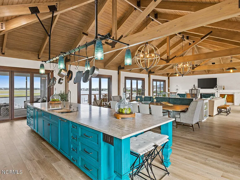 Wilmington Beach Mansion with Panoramic Views, renovated turquoise and natural wood kitchen with vaulted ceilings and exposed wood