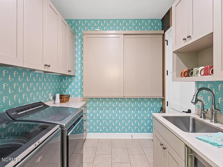 Wilmington Beach Mansion with Panoramic Views, modern laundry room with bold turquoise wallpaper