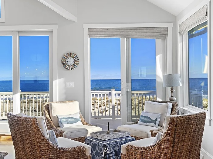 Renovated LBI Beach Mansion, interior of 6601 Ocean Blvd, Long Beach Township, NJ showing direct Atlantic Ocean views from the vaulted ceiling living room