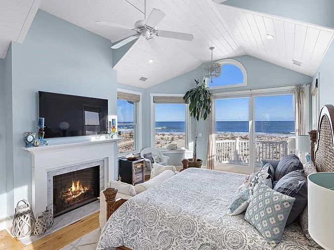 Renovated LBI Beach Mansion, interior of 6601 Ocean Blvd, interior master bedroom with working fireplace and atlantic ocean views