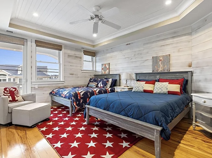 Renovated LBI Beach Mansion, interior of 6601 Ocean Blvd, interior guest bedroom with nautical design facing the atlantic ocean