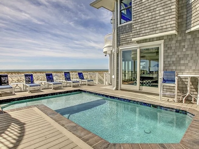 Renovated LBI Beach Mansion, interior of 6601 Ocean Blvd, exterior in ground pool overlooking the atlantic ocean beach