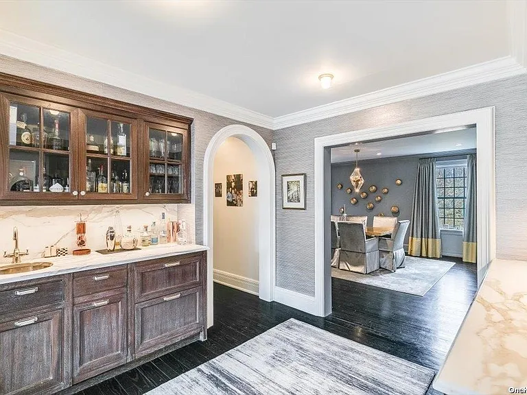 Locust Valley New York mansion, interior modern white and grey living room with bar