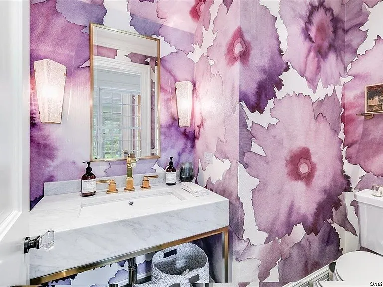 Locust Valley New York mansion, modern powder room bathroom with bright purple floral wallpaper