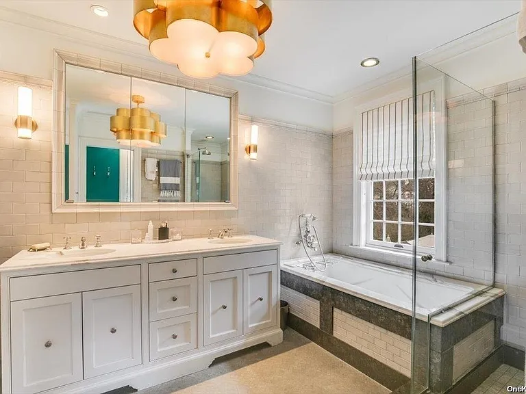 Locust Valley New York mansion, modern master bathroom with lots of natural light