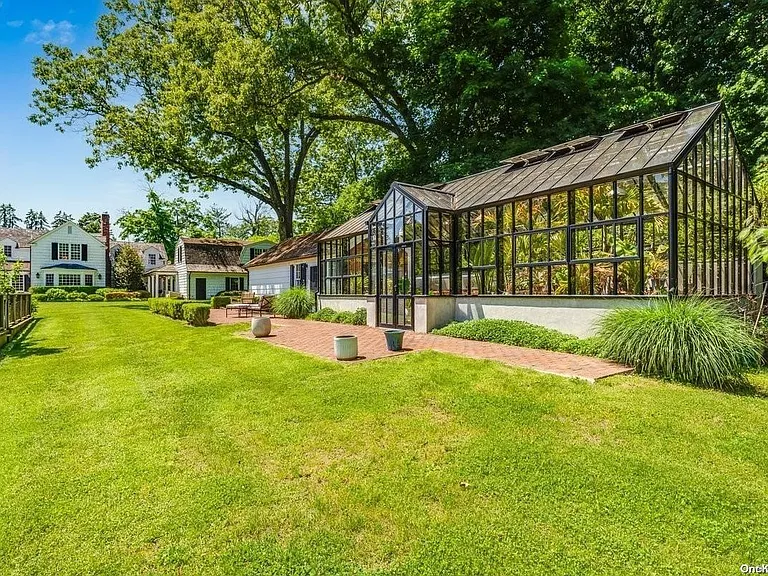 Locust Valley New York mansion, modern glass greenhouse with vegetables